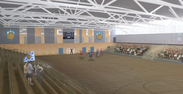 Íþróttahús með einum keppnishandboltavelli. Með því að draga stúkurnar til hliðar verður hægt að koma fyrir tveimur handboltavöllum í fullri stærð