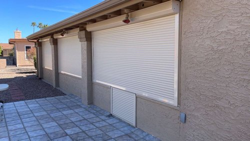 front patio with closed rolling shutters