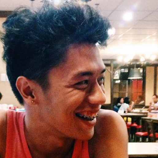 My half-brother, smiling more than half his face off. 