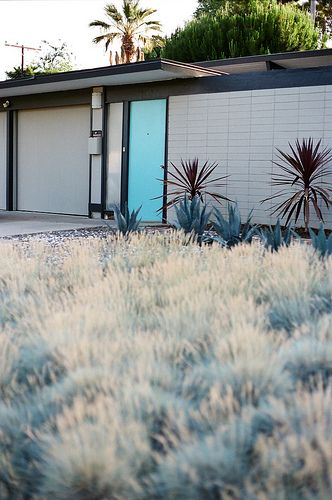 Gray house with teal door