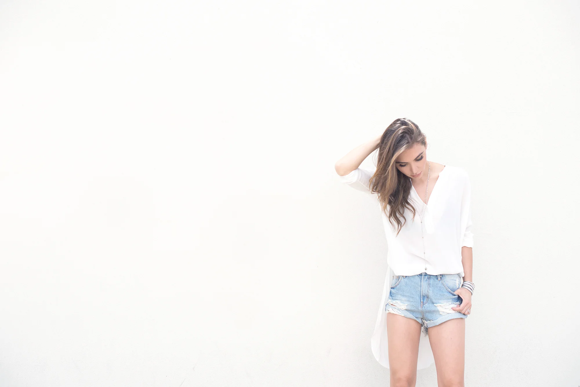 White blouse and denim shorts
