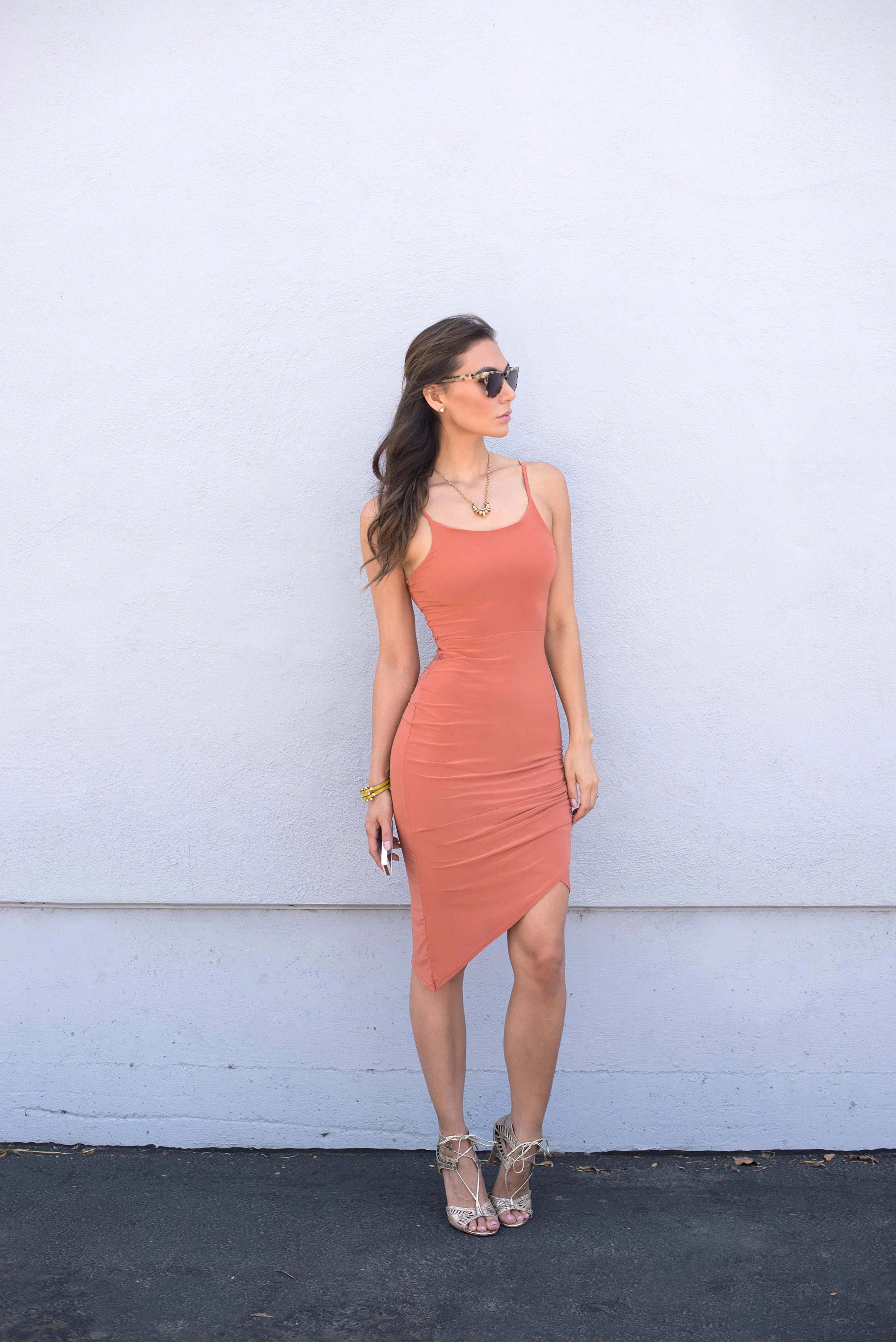 Komono sunglasses, pamela love necklace, and body conscious asymmetric dress