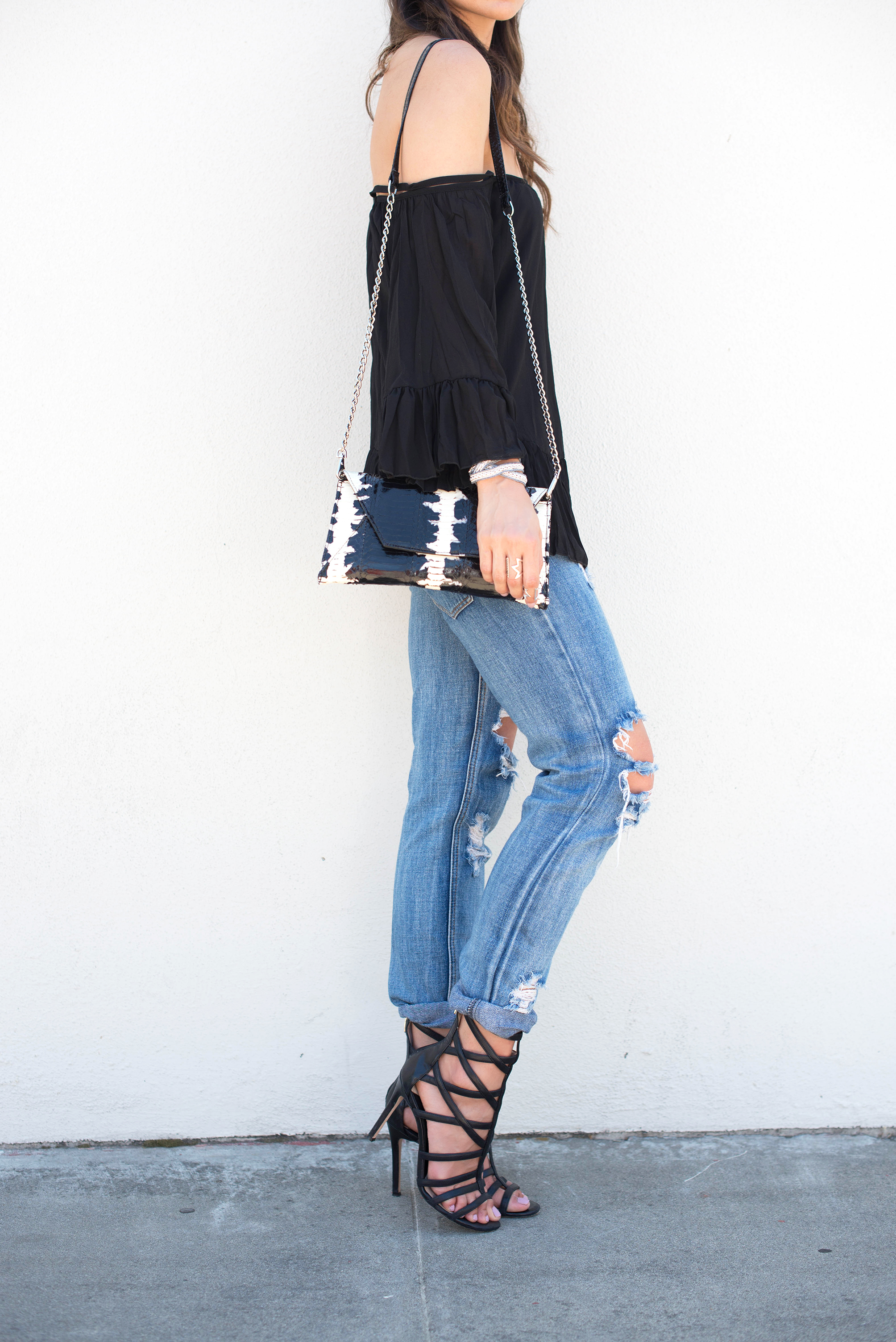 Off the shoulder Bardot Top, snakeskin clutch, and One Teaspoon Awesome Baggies jeans