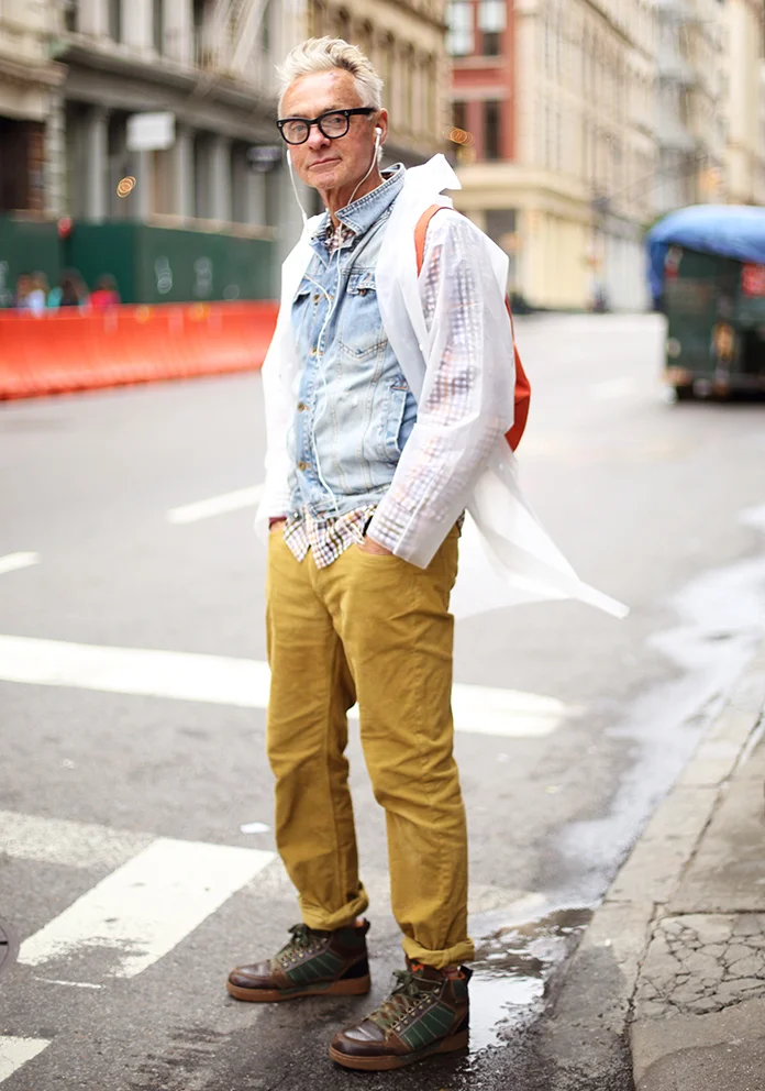 Layer denim over a playful button-up and under a see-through pancho for those rainy days. (Photo of Corey)