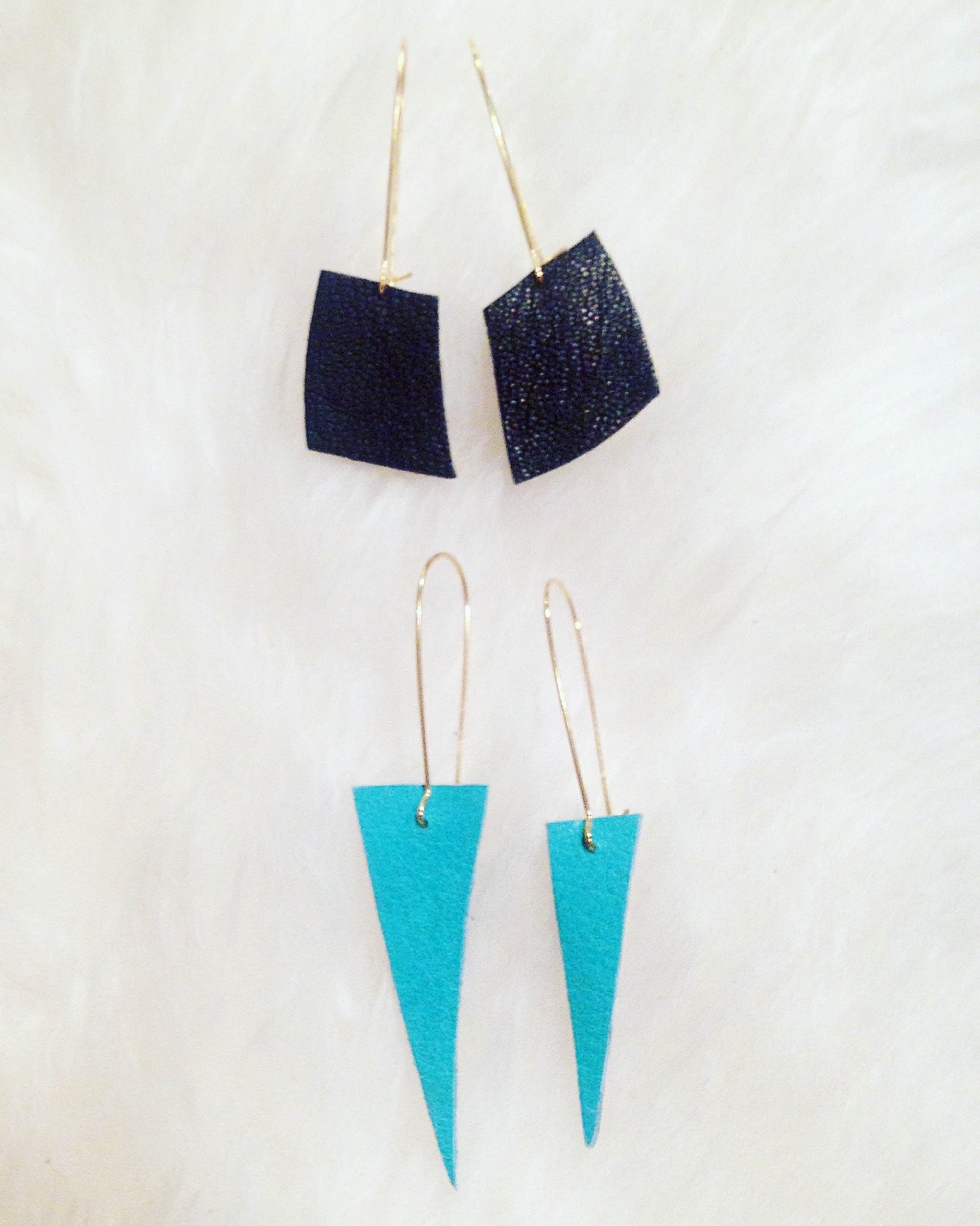 Hand-cut repurposed leather earrings on surgical stainless steel hoops. The leather is from high-end bag makers in San Francisco. I have a variety of geometric shapes in stock.