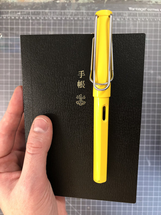 Hobonichi Techo Planner with pen clip and Lamy Safari fountain pen.