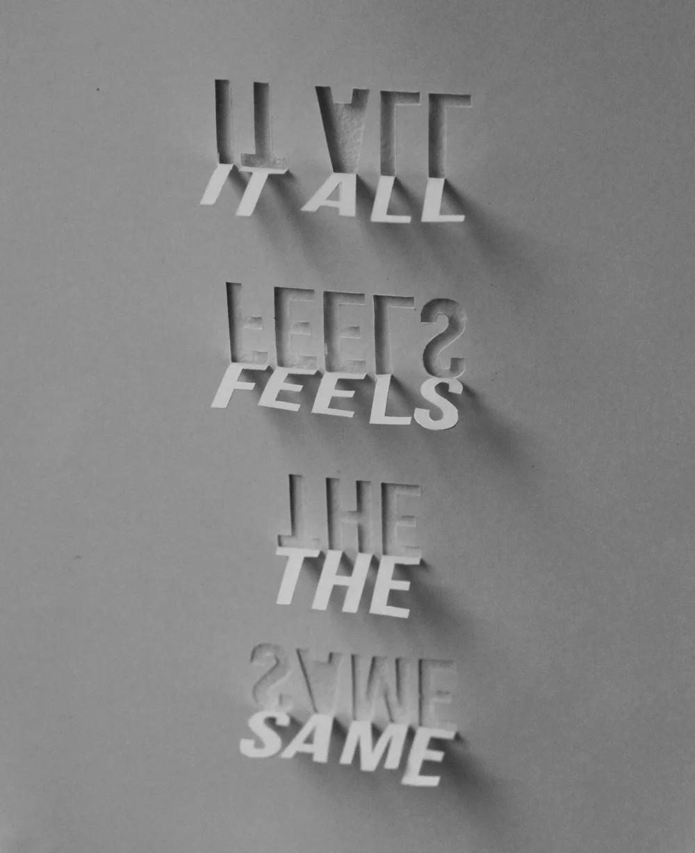 Stuck it to the wall to try a different angle. It loses the shadow text, but it still has a nice effect.