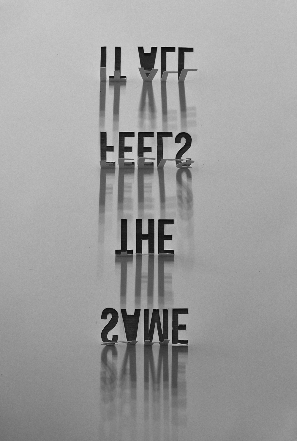 The multiple shadow effect comes from the lamp in the lounge which has five bulbs in a row. The words are the title of a Tennis song