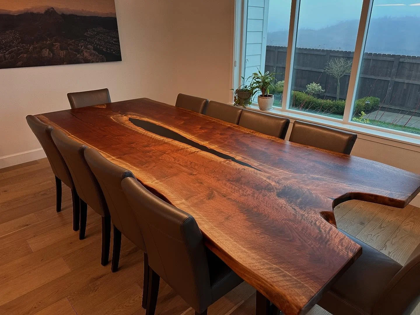 Thrilled to get some in home pics of this very special live edge Oregon walnut bookmatch slab table we delivered for Christmas. This one has a ton going on in it from feather crotch on both ends, a natural &ldquo;captains seat&rdquo; cut out, and cur