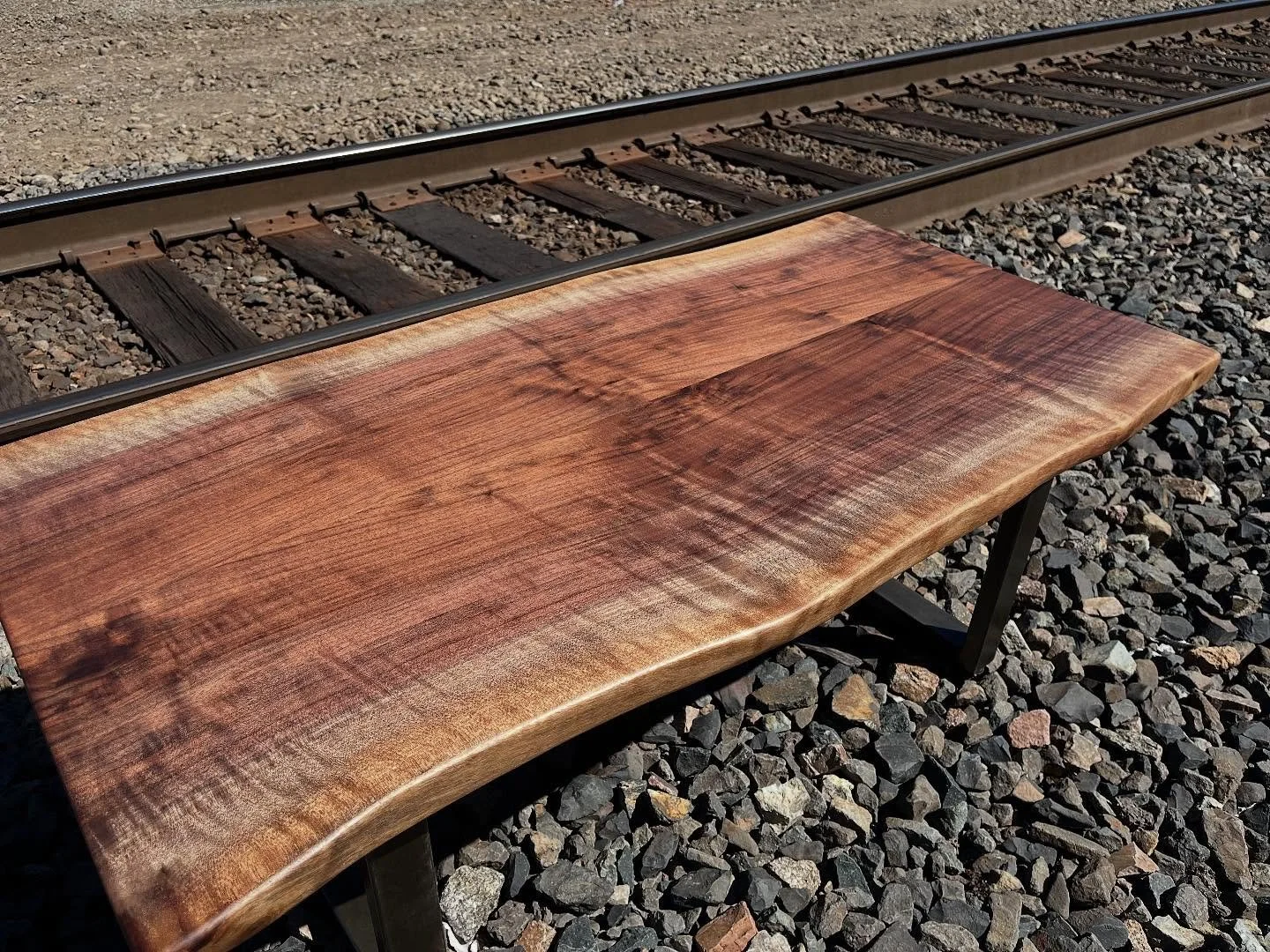 Some days, a table just deserves to bask in the sun before it goes to its forever home.

I call this one, Walnut on the Tracks. 

Right outside my shop, this little walnut beauty caught the light just right.
There&rsquo;s something about the way salv