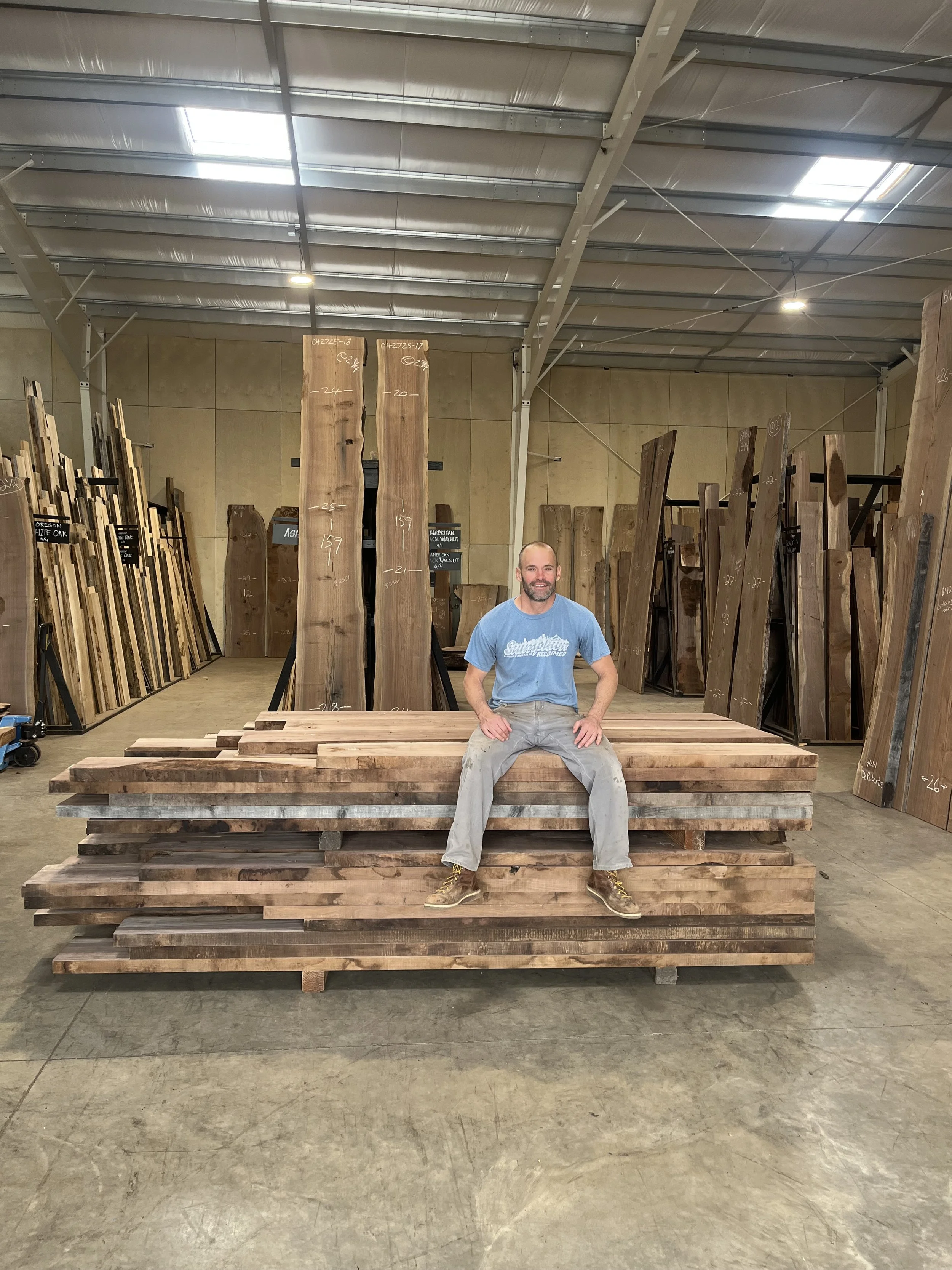 John selecting walnut at Goby Walnut showroom in Portland