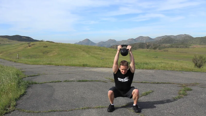 kettlebell squat and front raise jon ham.jpg