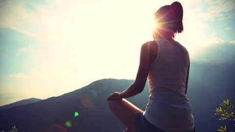 179_1_Treat_10-secrets-for-preserving-self-and-sanity_Slideshow_179_woman-doing-yoga-mountain_ts-479498312.jpg