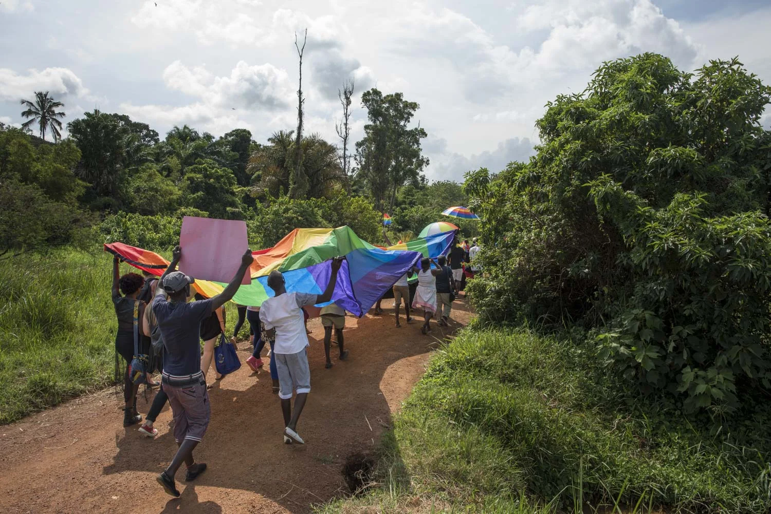 Members of the LGBT community and their supporters participate in a Pride march in a park on the banks of Lake Victoria in Entebbe, 40 km from Kampala. Safety concerns made it impossible to hold the march in a public location like downtown Kampala. Entebbe, Uganda. August 8, 2015. 