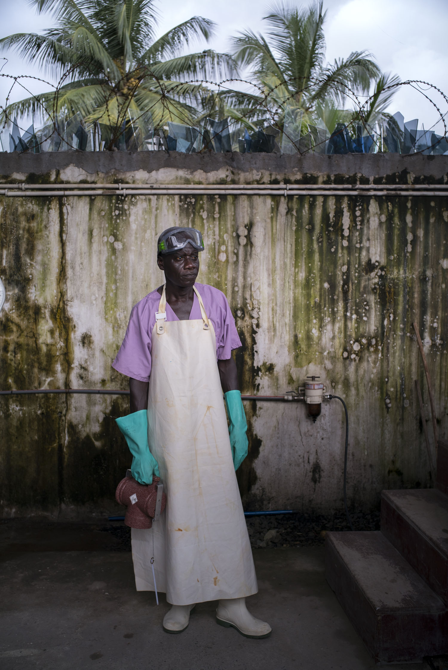  Alfred Walker, 52, Water and Sanitation Supervisor of an MSF hospital in Monrovia, Liberia, stands by the stairs leading to the incinerator, which is used for safe disposal of medical waste. In the aftermath of the the ebola epidemic of 2014/15 that