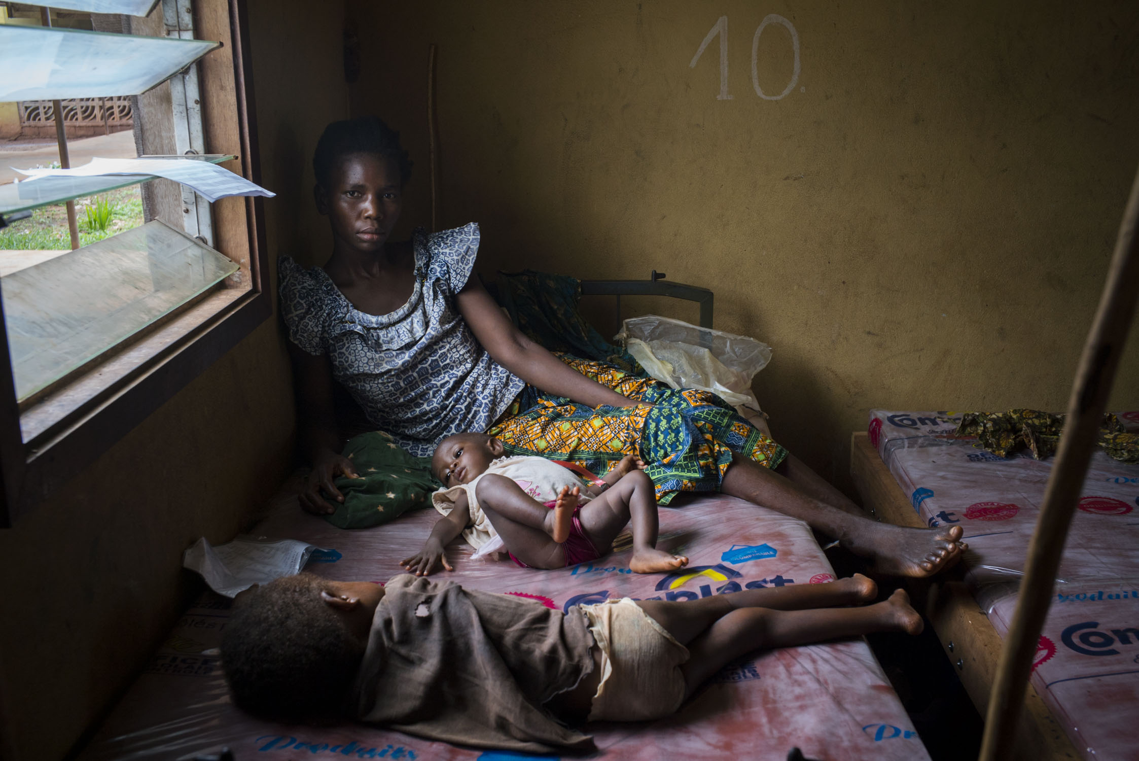  Madeleine Ngimambi, sits with her 7-month old daughter, Madeleine Pemu, who is receiving treatment for malnutrition in the MSF wing of the hospital in Monga, a town in a remote region of northern Democratic Republic of the Congo (DRC). Madeleine arr