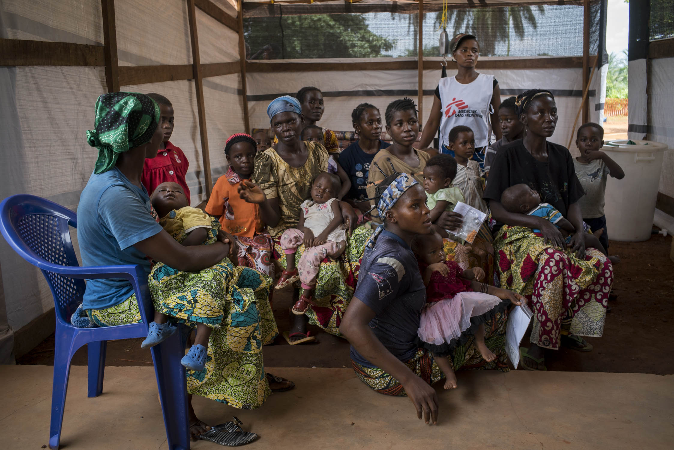  Mothers hold their sick children in the crowded waiting room of the MSF wing at a hospital in Monga, a town in a remote northern region of Democratic Republic of the Congo. MSF arrived to the area in response to a measles epidemic, therefore, only c