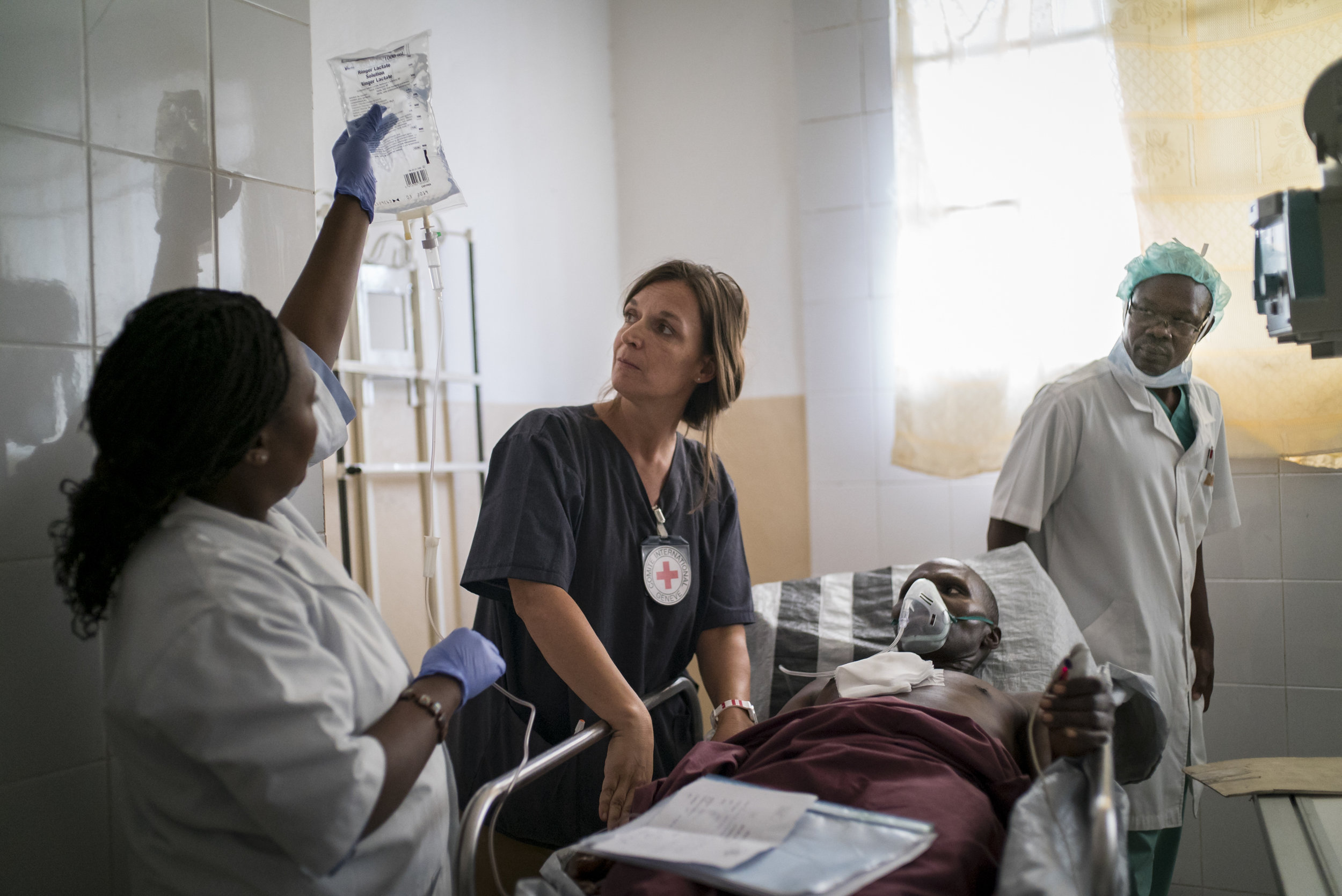  Anne Muller, the head nurse of the surgical team at Ndosho hospital in Goma, DRC, prepares a patient for emergency surgery. The patient, Patrick Gasana Wabazazo, 44, was shot in the chest (thorax) when he was caught in a crossfire between armed men 