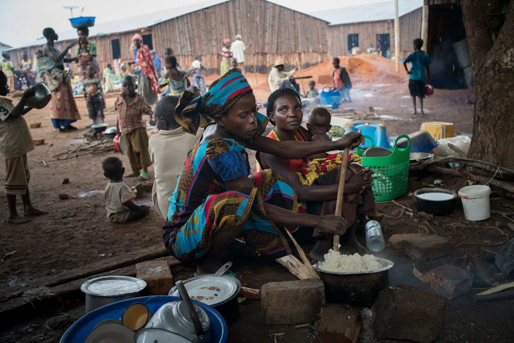  Congolese refugees wait at the reception center in Kyangwali, Uganda, where refugees spend several days before being transferred to a settlement (aka camp). Since December, approximately 50,000 refugees have arrived on boats used to cross Lake Alber