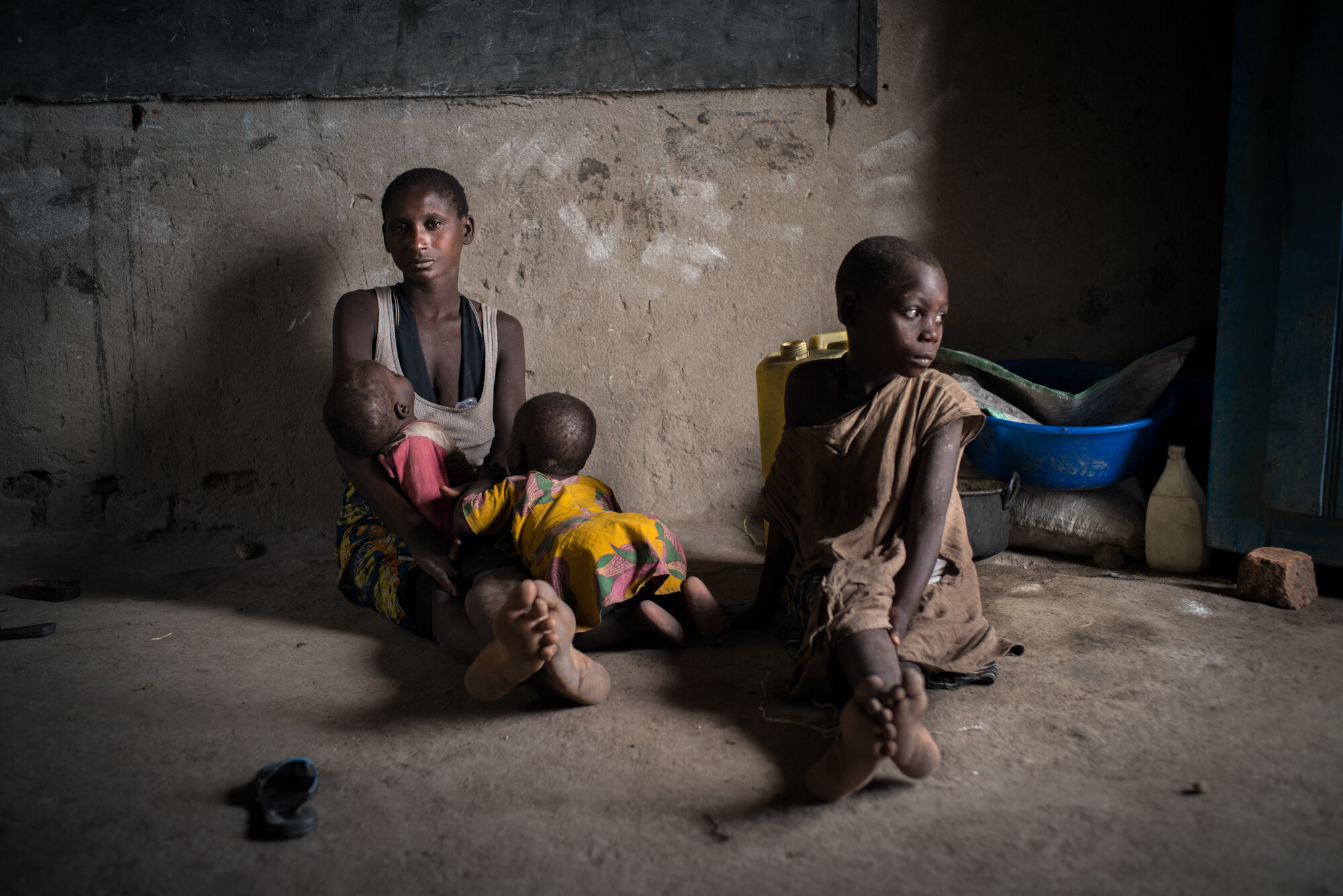  Francois Love, 30, and her children seek shelter in a school in Kasenyi, a town on the coast of Lake Albert. Kafe - mother of 5 - left 5 days ago. People here have fled their villages after militias arrived, burning houses and attacking people with 