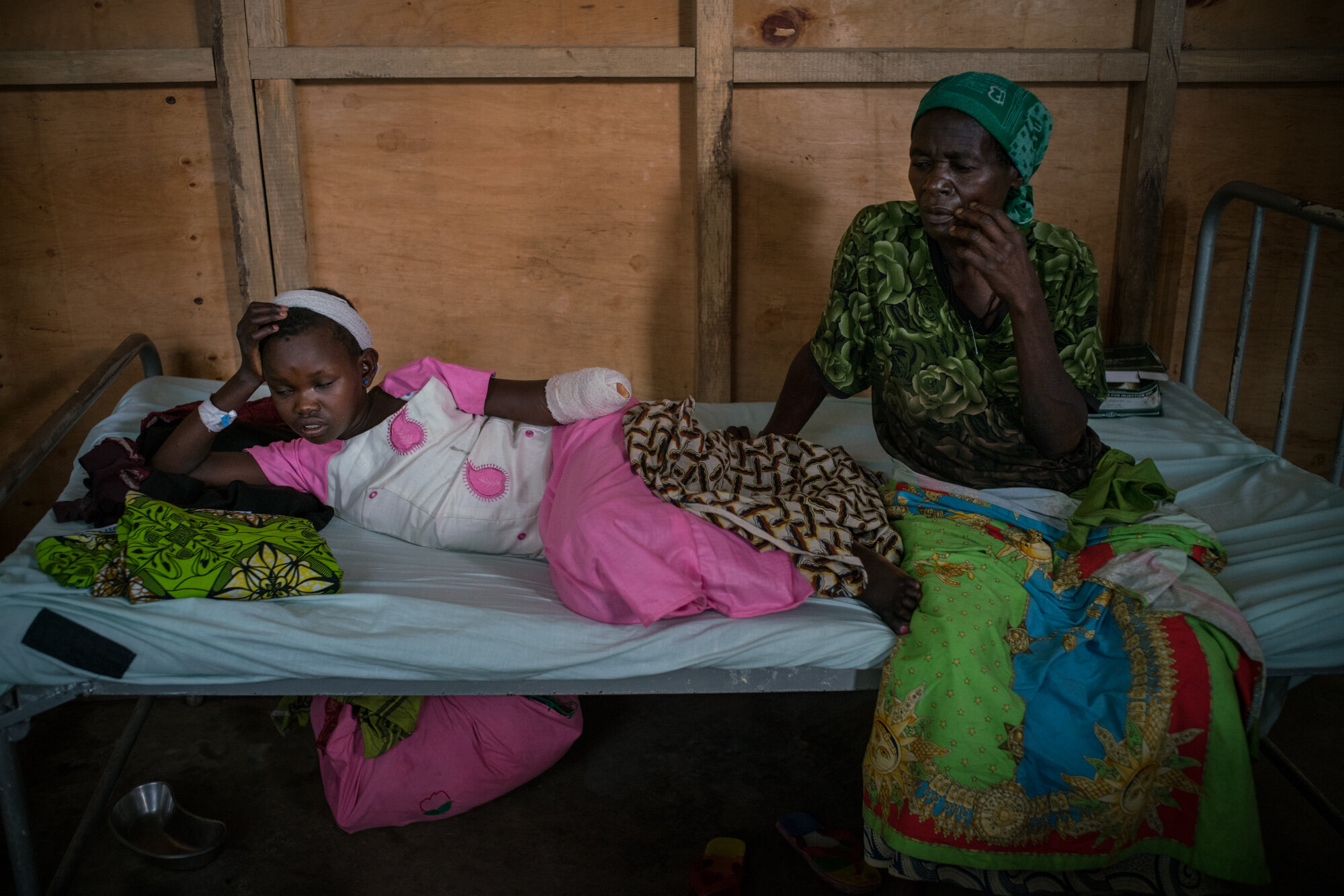 Grace Mave, 12, barely survived the attack on her village, Tche, 75 km north of Bunia, on February 11. Militias attacked in the morning at 10 AM. Grace watched as they raped her pregnant mother and used a machete to cut open her belly and remove the