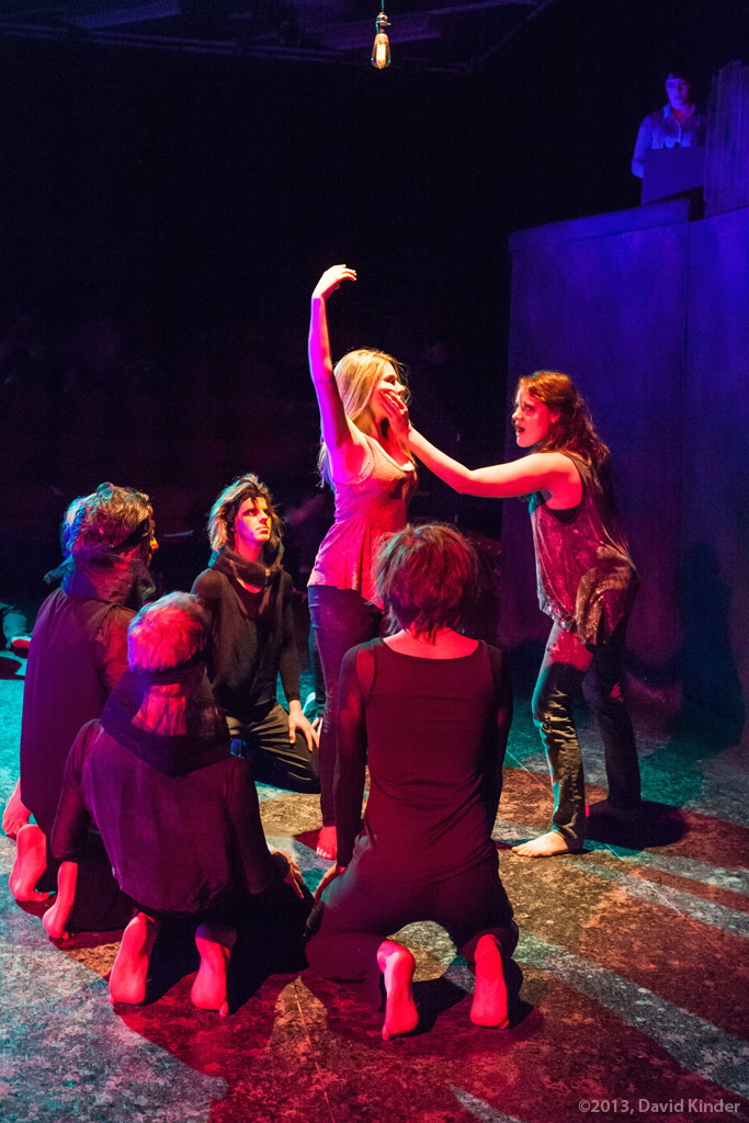 Jessica Tidd as Tess and Amber Kiara Mithcell as Vea with members of The Watchers and The Fire in Statue
