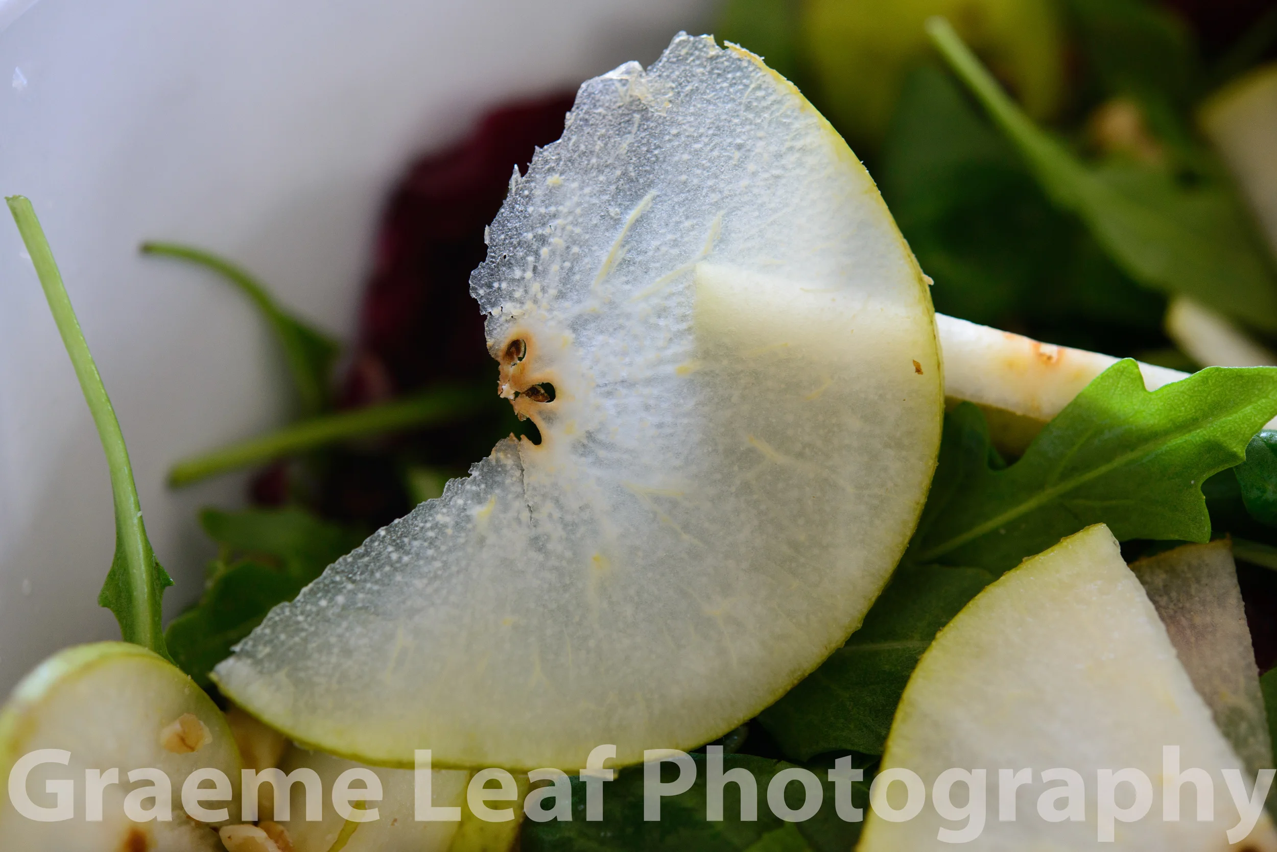 Thinly Sliced Pear on Salad