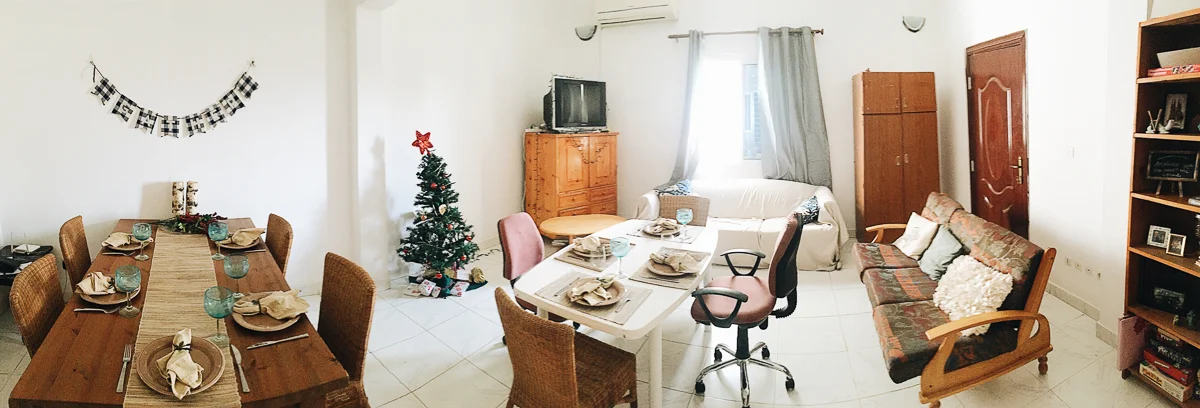 And speaking of holiday parties, here’s a shot of our set up for a Christmas party with some of our team members. Our place also came with a white patio table so we pulled it in and set it in the middle. This should give you an idea of how huge the living room/dining room area is that it can fit a table for 8, another table, two couches, and three other pieces of furniture! And what’s crazy is that I’ve seen a lot bigger living rooms that ours!