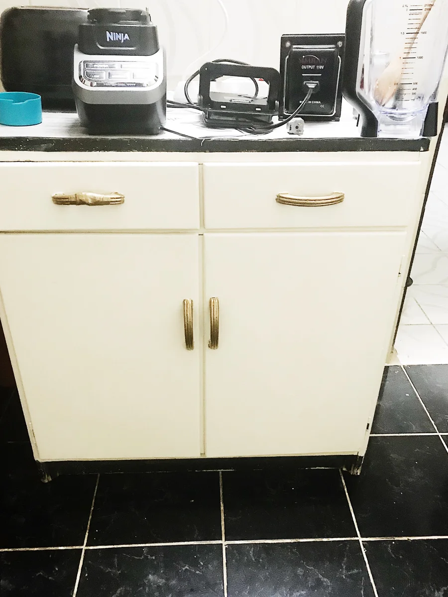 We got this piece from our teammates as well and I painted it white (despite what the photo shows) and painted the handles gold. Notice our transformer and Ninja blender. :)