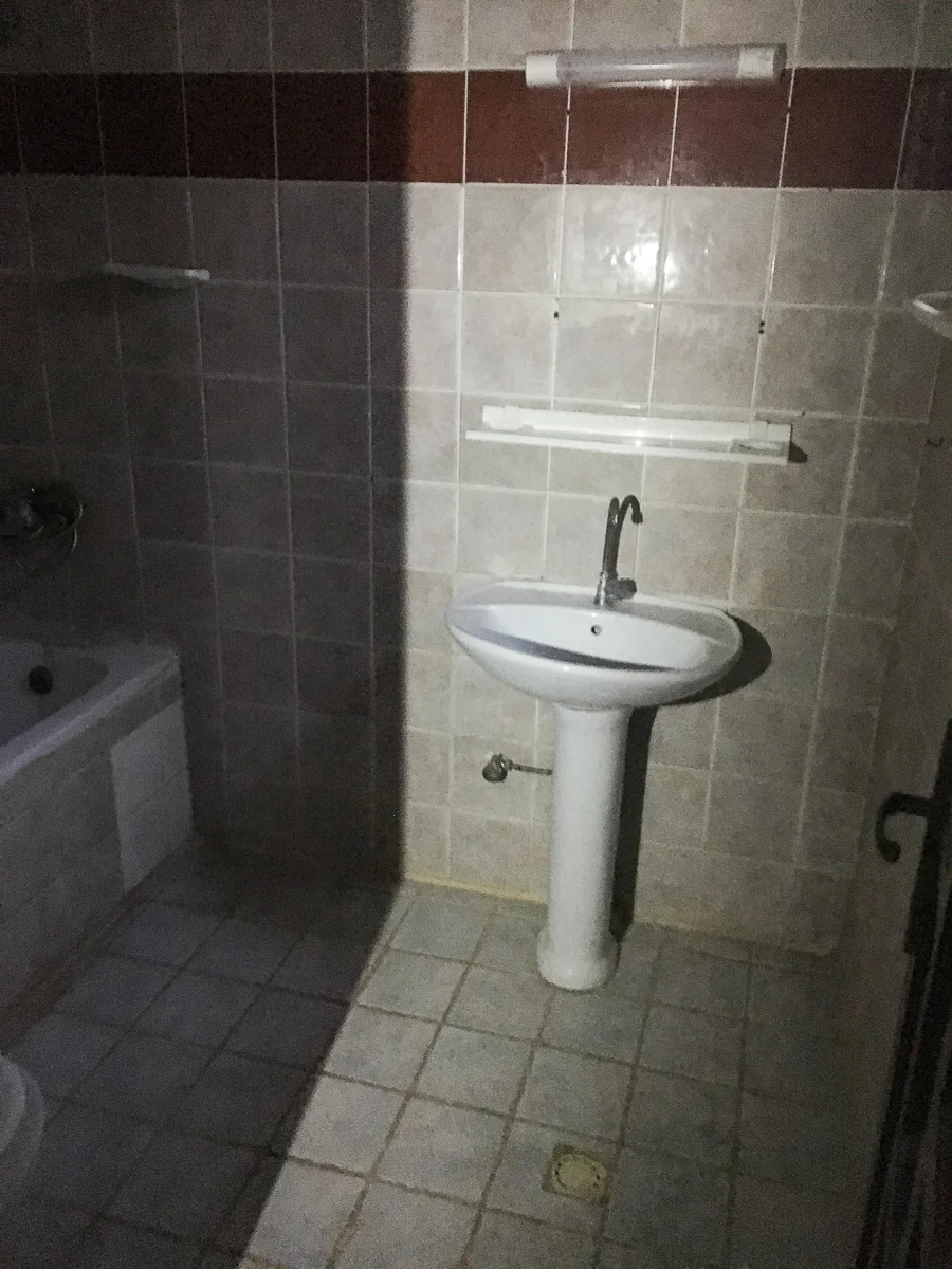We had a small storage piece to left of the sink for our stuff and also had hanging organizer on the back of the door. I’ll link a similar one below.