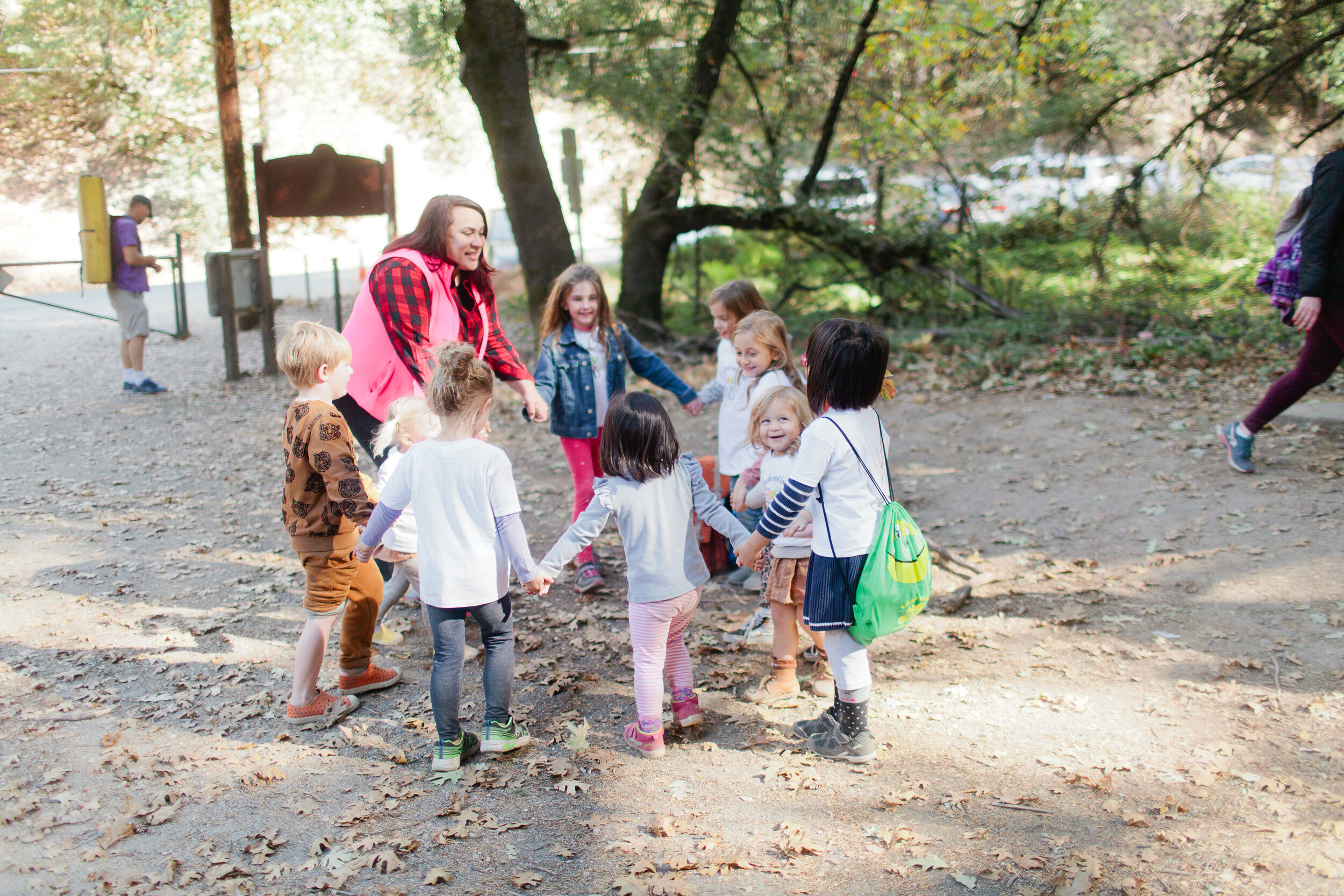 Senses Vanessa at circle with kids with TT shirts.jpg