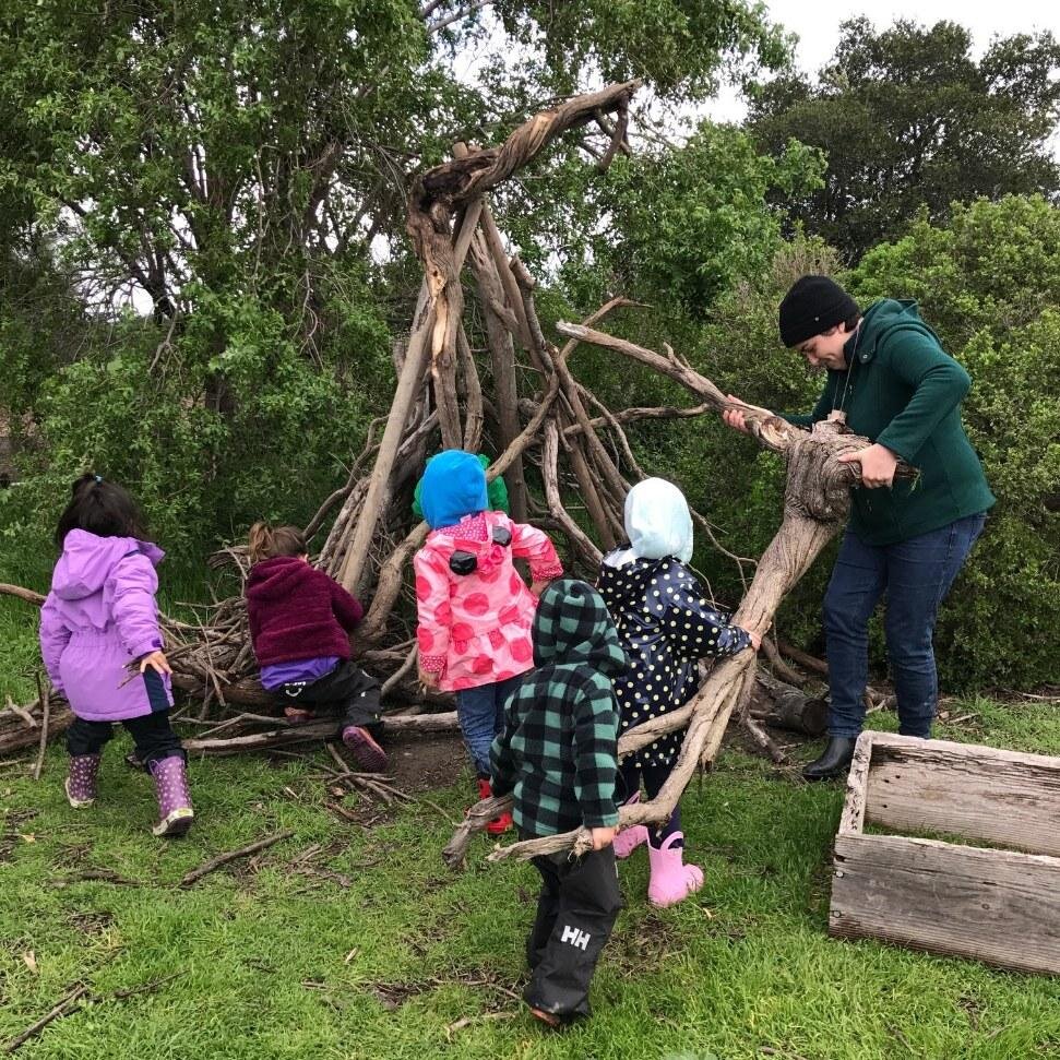 Maggie and kids building a fort.jpg