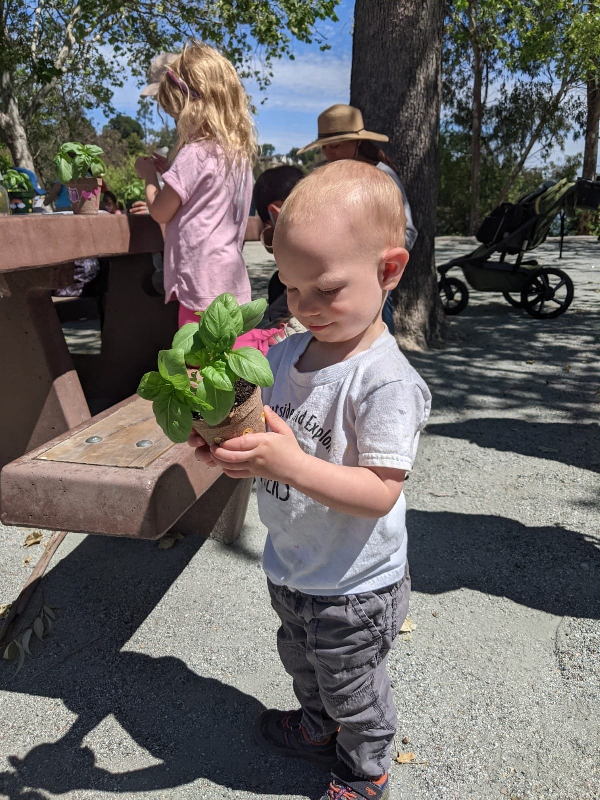 blond boy with crafted plant.jpeg