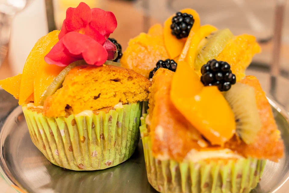 Vegan cupcakes...mango and lime with fresh fruit and edible flowers