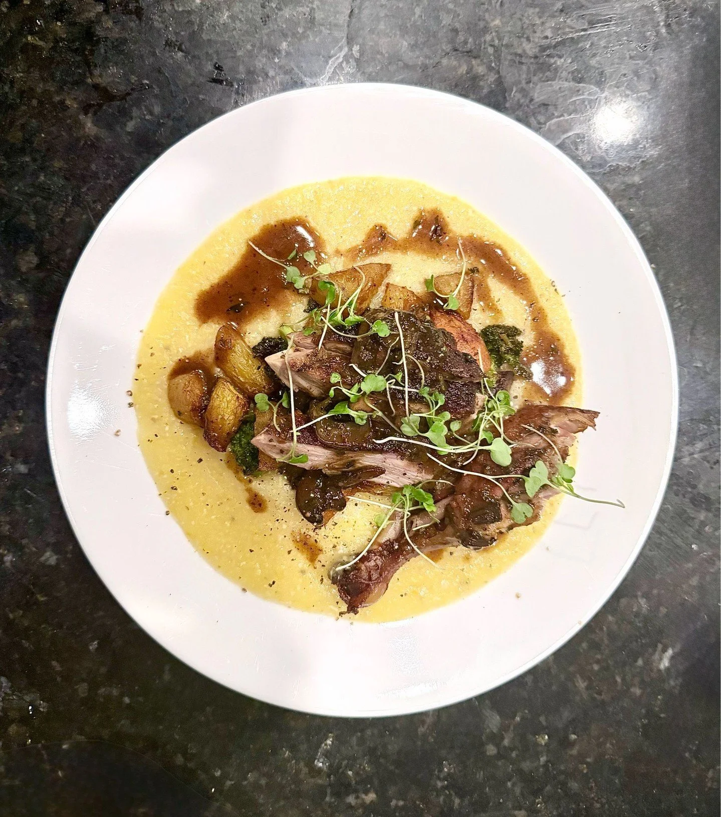 Roasted duck, done right.

Confit leg. Slow-roasted breast.
Duck fat vegetables, creamy polenta, a rich pan sauce, and a touch of micro arugula for balance.

Layered, intentional, and built around depth of flavor.
This is the kind of dish that remind