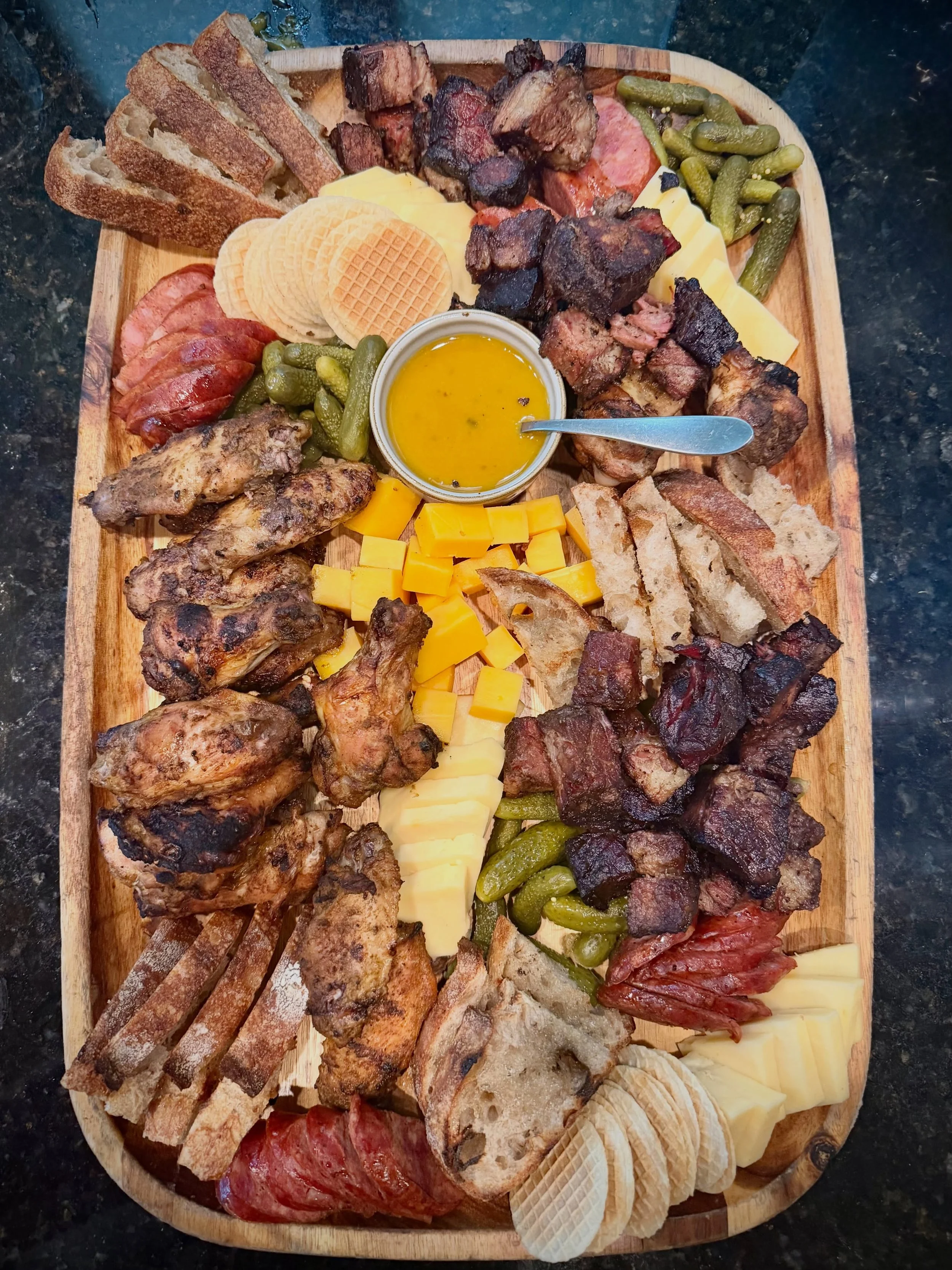 Smoke. Fire. Good ingredients.

A preview of our new Smoke &amp; Fire Catering Menu, built around the grill, smoker, and the kind of food that brings people together.

This Smokehouse BBQ Board features smoked sausage, burnt ends, grilled chicken win