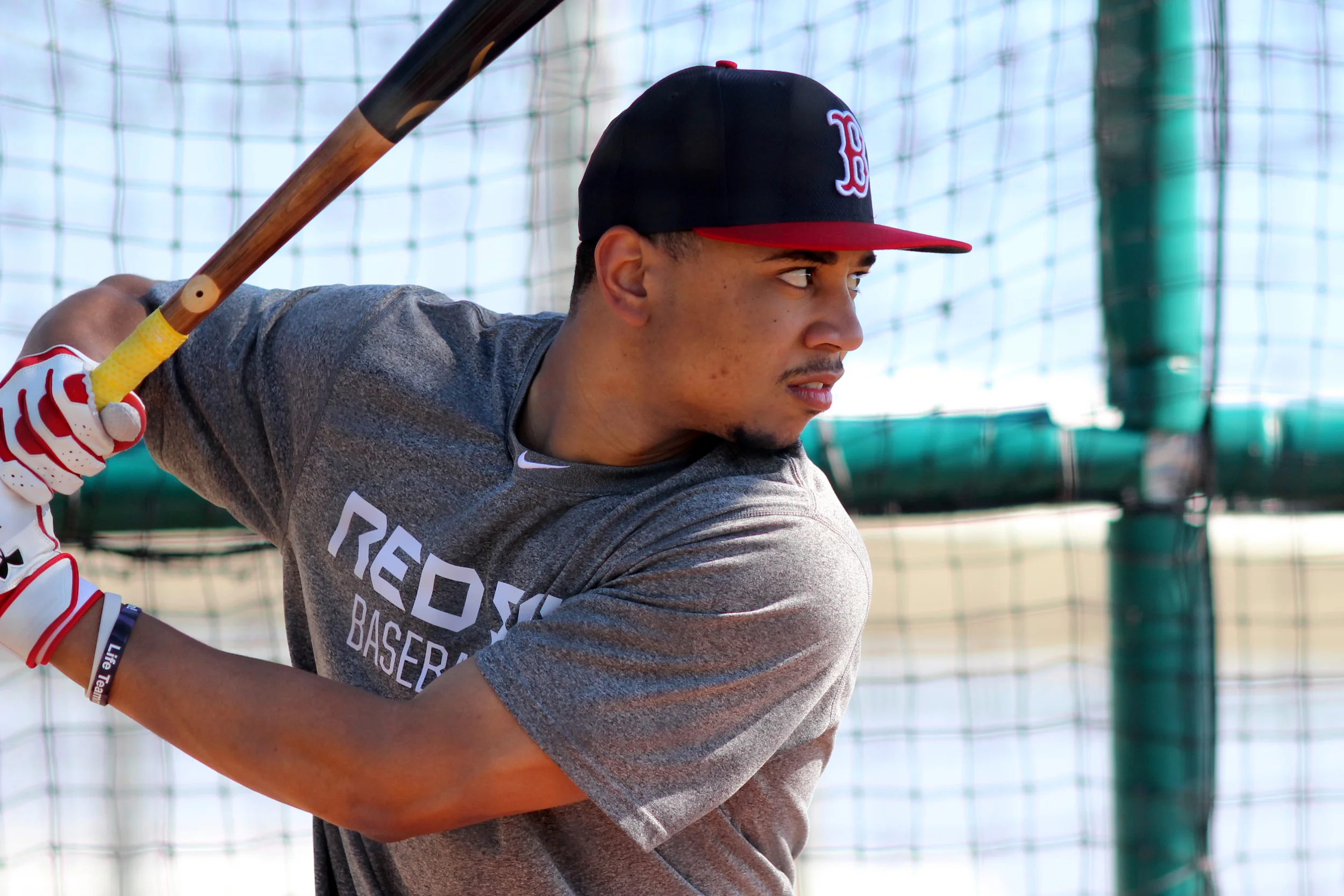 Mookie Betts goes through batting practice during Red Sox spring training in Fort Myers 