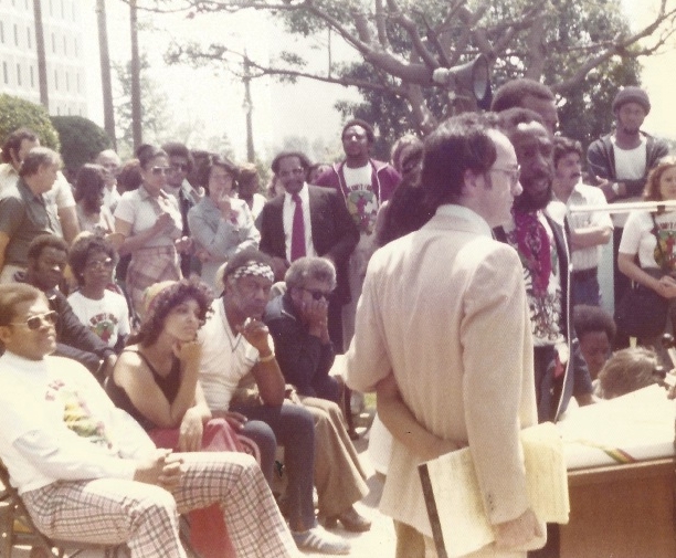 Jack Healey and Dick Gregory make a speech for the kickoff of the Dick Gregory run to end world hunger outside the office of Mayor Bradley in Los Angeles on his first leg of over 3000 in total.