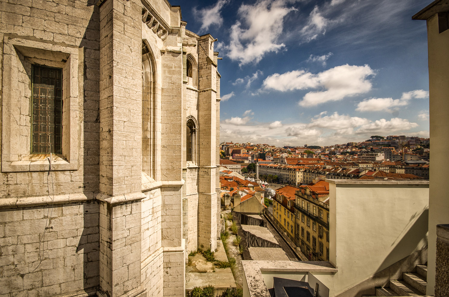 From this Lisbon viewpoint it's possible to see Carmo convent in the foreground and Rossio Square in the background - photo taken from the Santa Justa lift during a Lisbon photo tour.