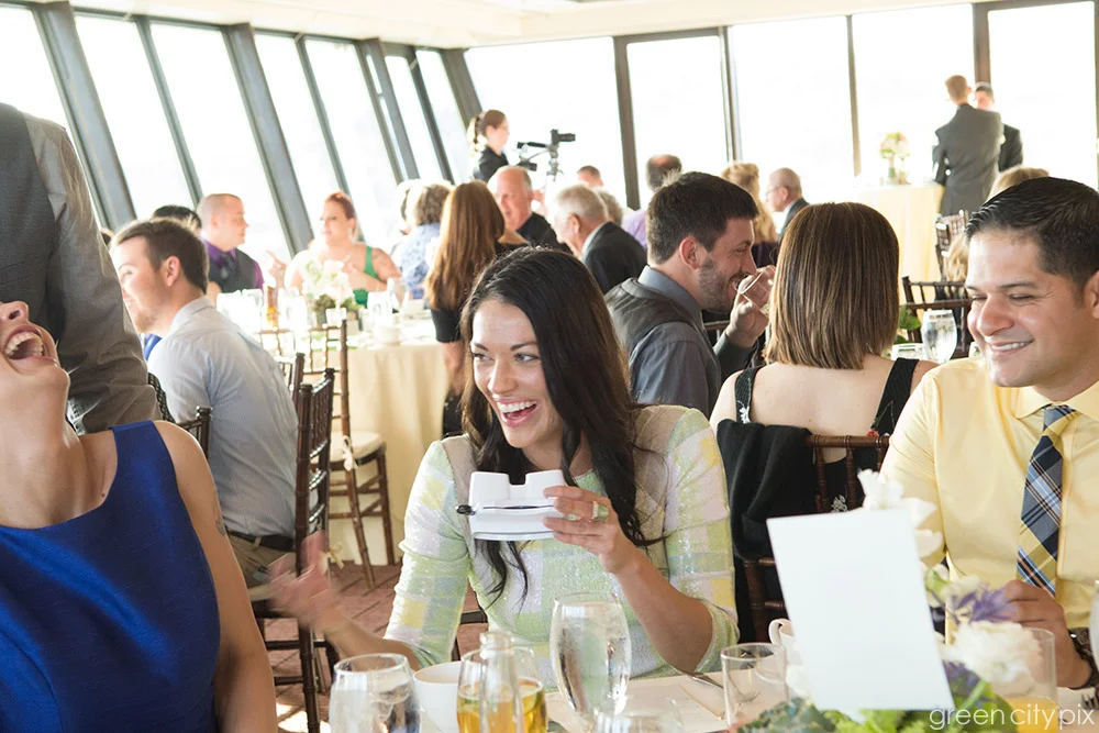 I strive to capture wedding guests having fun. Oftentimes, the people aren't aware that they're being photographed, and their expressions are completely natural.