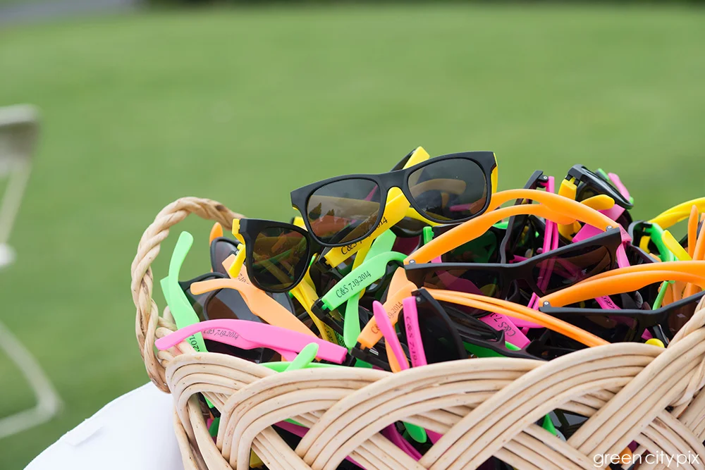 Colorful sunglasses were given to guests for the outdoor ceremony. 