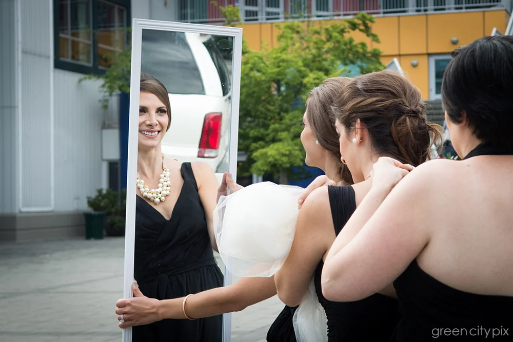Mirror, mirror: The bridal party stepped out of their limo carrying this big wall mirror. They knew they were being funny, and didn't mind me taking a photo of them primping.