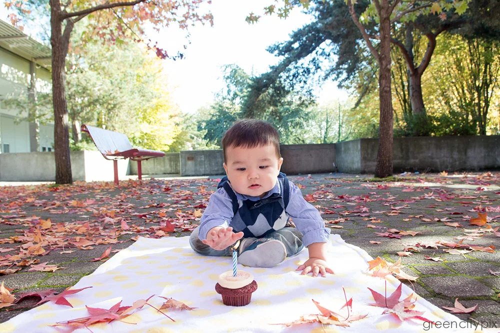 Sebastian was really curious about the candle. But don't worry, he didn't burn himself. When he reached out for the flame, his mom said that he was definitely his dad's son.