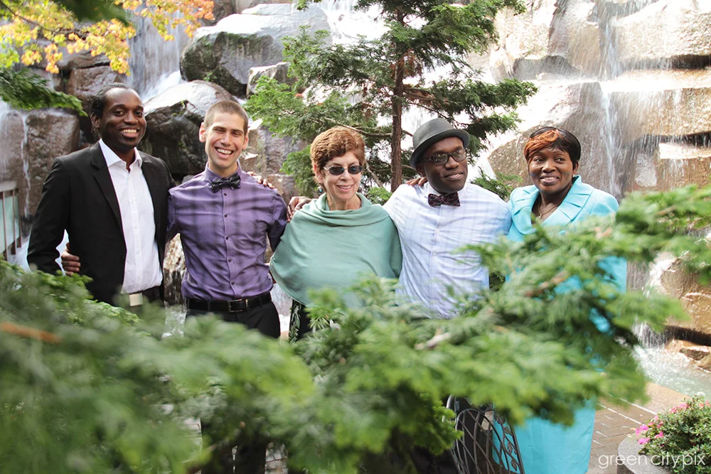 Family photos were taken at the Waterfall Garden Park on Second and Main. The park is open from 8 am - 5:30 daily. Check the park's Facebook page for updated information.