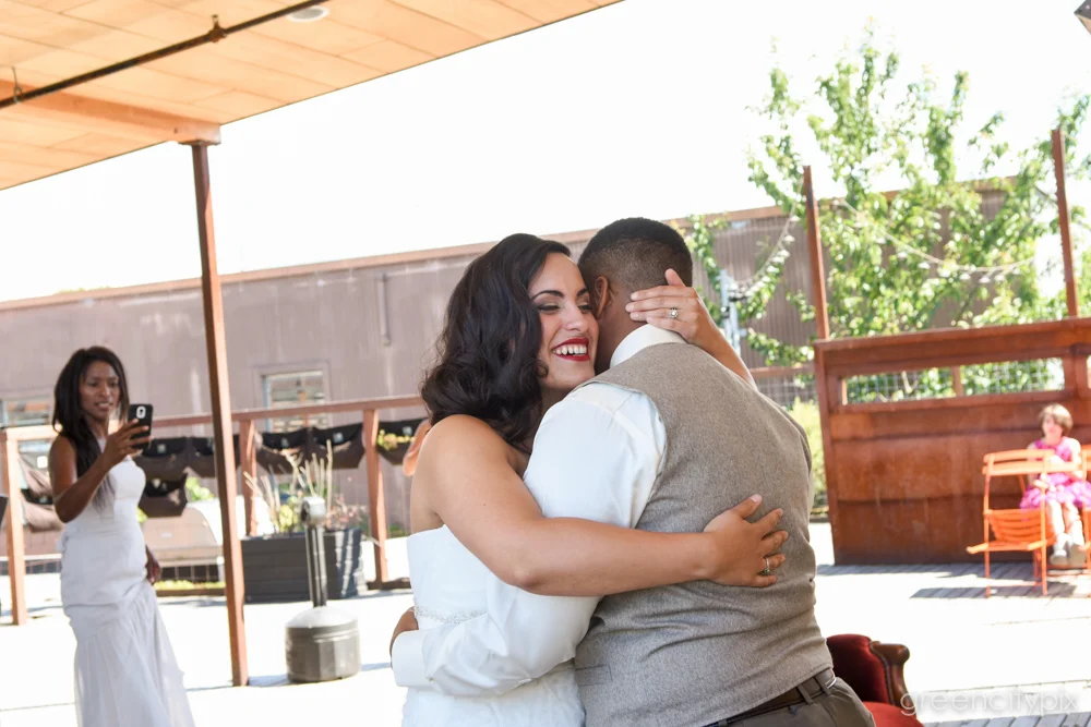 A hug before they jumped the broom and made it all official!