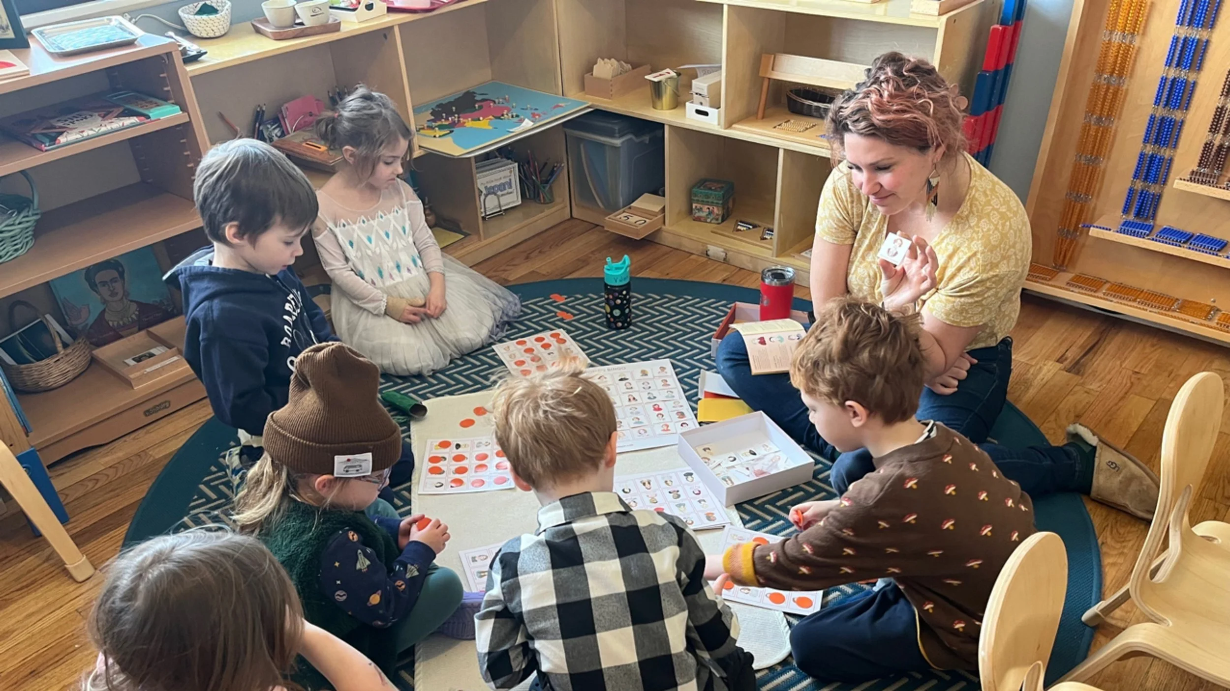 Emily+with+kids+in+class.jpg