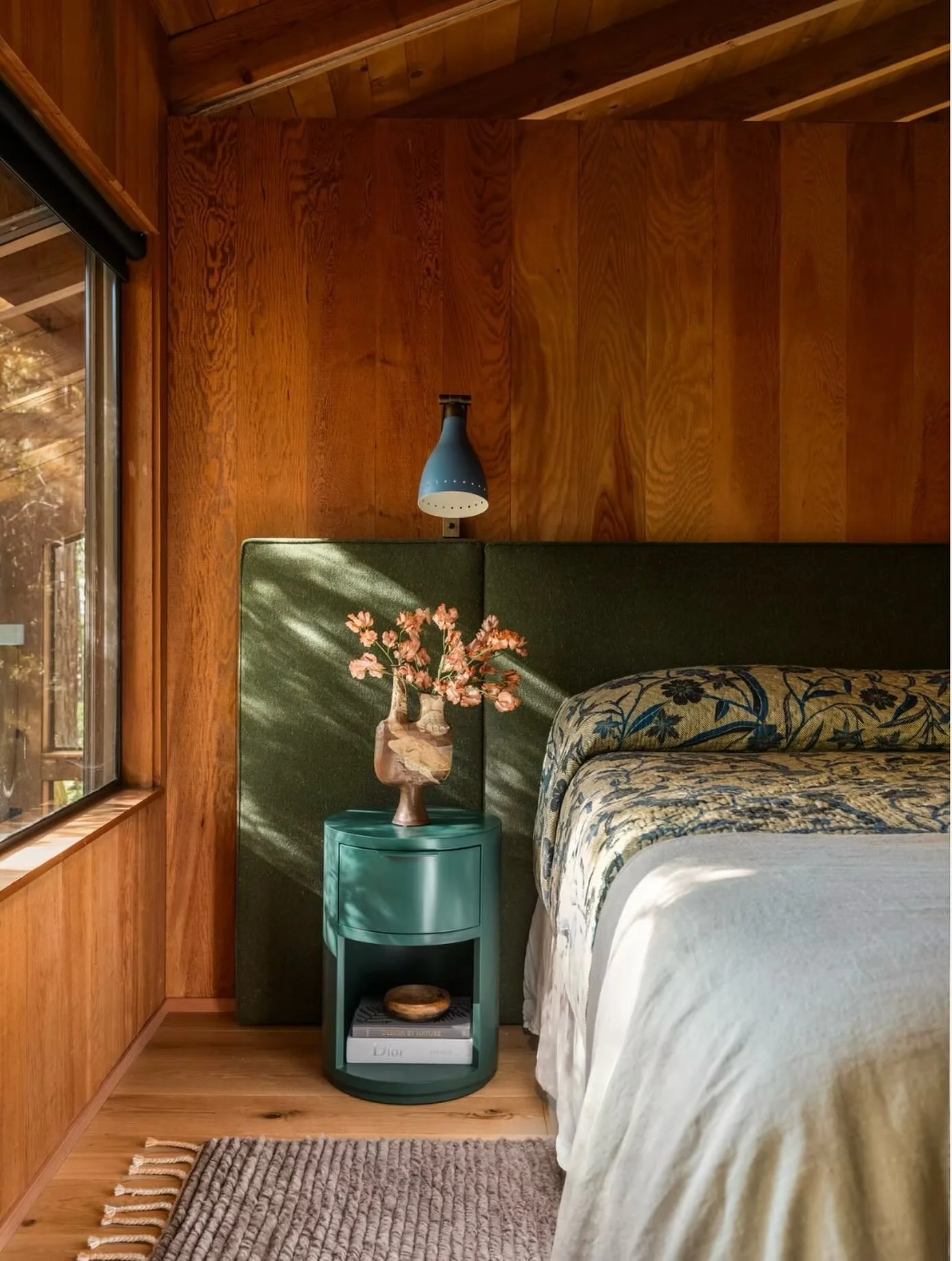 What this photo doesn&rsquo;t show is the vast uninterrupted forest right outside the window as your evening and wake up view. Luckily this is my side of the bed. 😁

As an homage to the 70s - the era in which this home was built - the headboard is m
