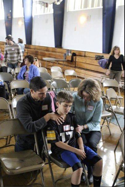 Gents praying with kid.jpg