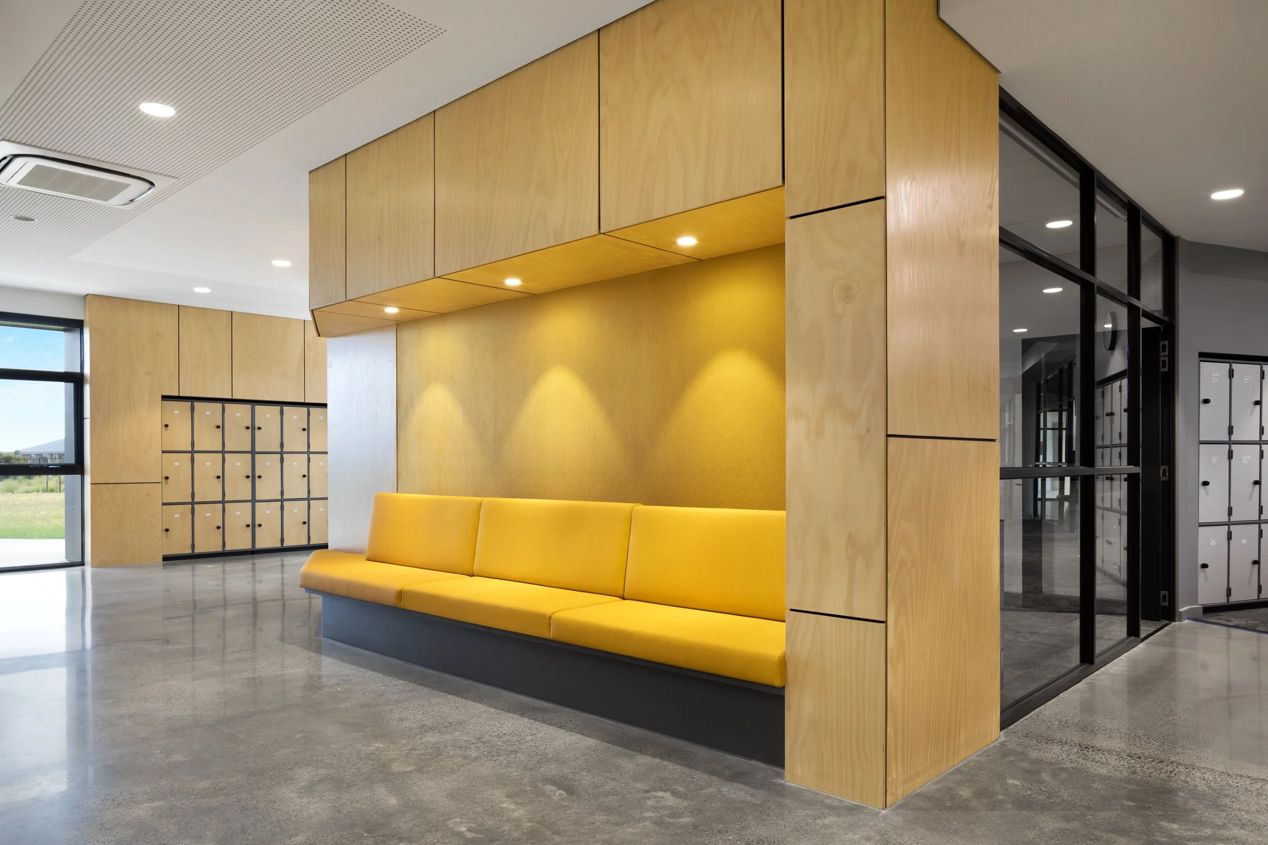 interior architecture photography of waiting area with lockers clad in ply wood photograph taken by sarah anderson photography architecture by clarke hopkins clarke build by lyons construction group and kildare construction group