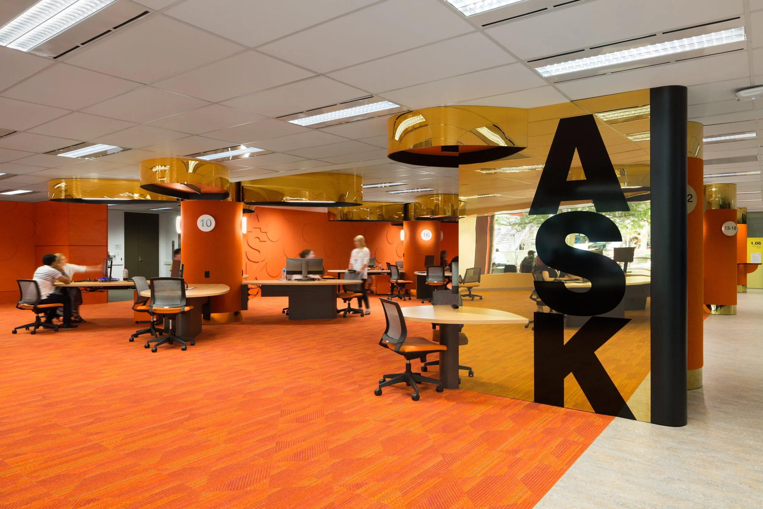 harmer architecture interiors of monash university with orange carpet and gold pillars